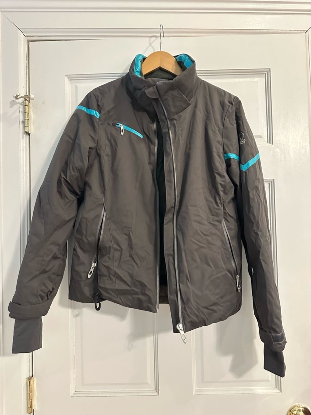 Spyder Women’s Gray Ski with turquoise accents.  Size 6.